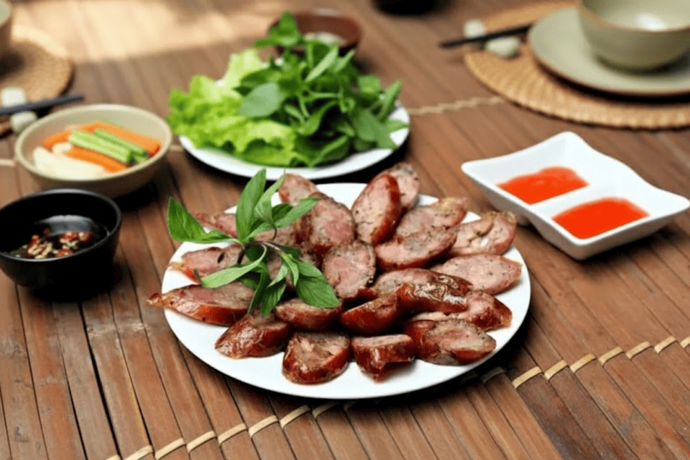 Sliced lap xuong served with chili sauce